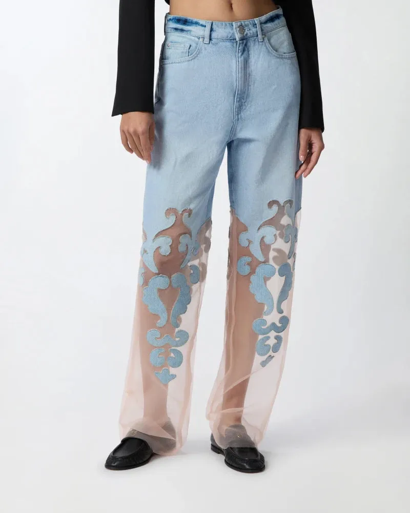 Denim jeans with applique and organza